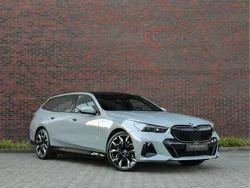 Grijs, metallic lak Gebruikt 2024 BMW 550 Comfort Edition Stationwagen | € 99.950
