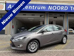 Bruin, metallic lak Gebruikt 2014 Ford Focus Titanium Hatchback | € 9.949 (Eerlijke prijs)