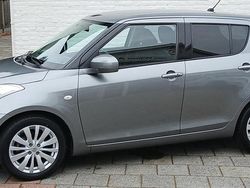 Grijs (metallic) Gebruikt 2014 Suzuki Swift Exclusive Hatchback | € 9.899 (Eerlijke prijs)
