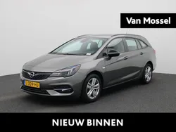 Grijs, metallic lak Gebruikt 2021 Opel Astra Business Edition Stationwagen | € 12.900 (Goede deal)