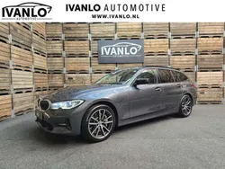 Grijs, metallic lak Gebruikt 2021 BMW 330e Executive Stationwagen | € 31.800 (Goede deal)