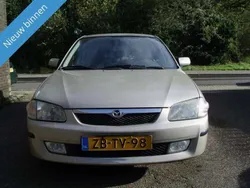 Beige, metallic lak Gebruikt 1999 Mazda 323F Hatchback | € 1.949