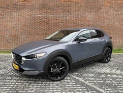 Polymetal gray (grijs metallic) Gebruikt 2023 Mazda CX-30 Homura-Line SUV | € 32.845 (Iets duurder)
