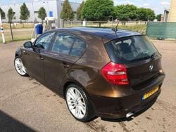 Brons Gebruikt 2010 BMW 116 Hatchback | € 6.400