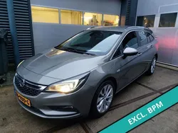 Bruin, metallic lak Gebruikt 2016 Opel Astra Business Stationwagen | € 5.250 (Duur)