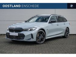 Brooklyn grau (grijs metallic) Gebruikt 2022 BMW 320e Shadowline Stationwagen | € 38.900