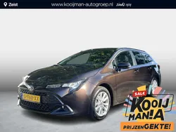 Bruin Gebruikt 2023 Toyota Corolla Hybrid Active Stationwagen | € 27.900