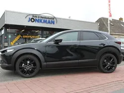 Zwart, metallic lak Gebruikt 2024 Mazda CX-30 Homura-Line SUV | € 33.850 (Eerlijke prijs)