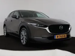 Titanium flash (bruin metallic) Gebruikt 2021 Mazda CX-30 Comfort SUV | € 26.945 (Eerlijke prijs)