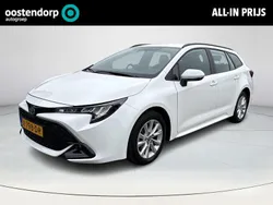 Wit Gebruikt 2023 Toyota Corolla Hybrid Active Stationwagen | € 26.750