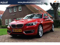 Rood, metallic lak Gebruikt 2016 BMW 230 Executive Coupé | € 19.445