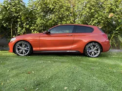 Oranje Gebruikt 2015 BMW M135 Hatchback | € 24.500 (Super prijs)