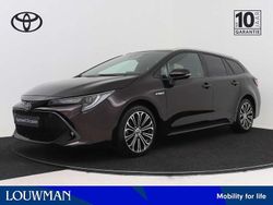 Bruin Gebruikt 2021 Toyota Corolla Executive Stationwagen | € 26.495 (Eerlijke prijs)