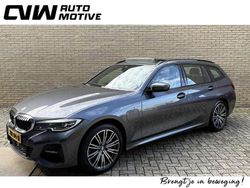 Grijs Gebruikt 2021 BMW 330e M Sport Stationwagen | € 26.900 (Eerlijke prijs)