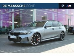 Skyscraper grey (grijs metallic) Gebruikt 2024 BMW 330e Shadowline Stationwagen | € 56.950
