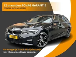 Zwart, metallic lak Gebruikt 2021 BMW 320e Executive Stationwagen | € 33.850 (Eerlijke prijs)
