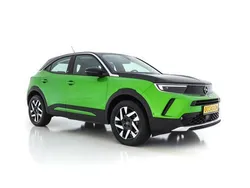 Matcha green (groen metallic) Gebruikt 2021 Opel Mokka-e Elegance SUV | € 18.945 (Eerlijke prijs)
