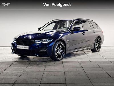 Blauw (metallic) Occasion 2022 BMW 320e Executive Stationwagen | € 33.495 (Iets duurder)