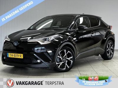 tweedehands Toyota C-HR 1.8 Hybrid Style/ Hybride!/ Automaat!/ Zwarte Hemel/ 18''LMV/ Camera/ Clima/ Navi/ Cruise/ Bluetooth/ Multi.LEDER.Stuur/ Elek.Pakket/ Isofix/ PDC V+A.