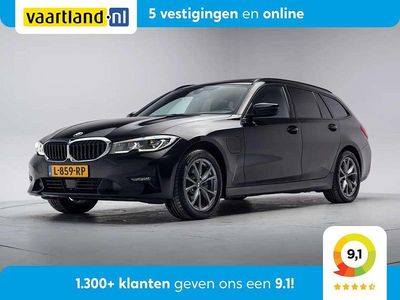 Zwart Occasion 2021 BMW 320e Sport Line Stationwagen | € 23.409 (Eerlijke prijs)