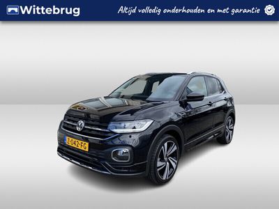 tweedehands VW T-Cross - 1.0 TSI 2x R-Line / AUTOMAAT/ PARK. SENSOREN/ BLUETOOTH/ ADAPT. CRUISE/ STOEL VERWARM./ NAVI/ CLIMA/ DAB/ 18" LMV/