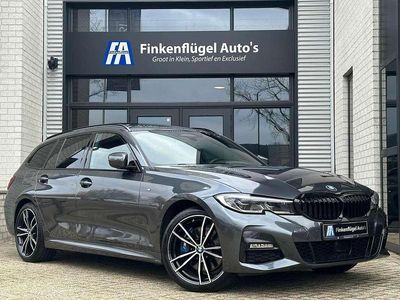 Grijs (metallic) Gebruikt 2020 BMW 330e M Sport Stationwagen | € 34.400 (Eerlijke prijs)