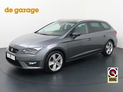 tweedehands Seat Leon ST 1.4 EcoTSI FR Connect | 150 PK | Automaat | Trekhaak | Stoelverwarming | Apple Carplay - Androidauto | Cruise | PDC | Stoelverwarming | Climate | Bluetooth | Sfeerverlichting | Automatische verlichting | Navi FullMap | Flippers | Spraakbedien