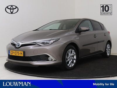 Bruin Occasion 2015 Toyota Auris Hybrid Hatchback | € 16.400 (Eerlijke prijs)