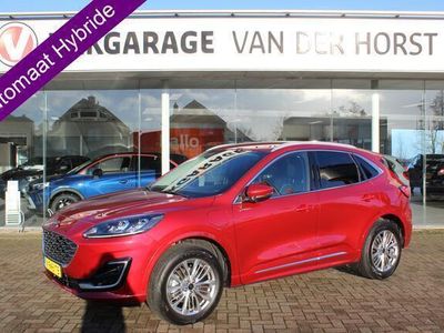 tweedehands Ford Kuga 2.5-225pk PHEV Vignale. Trekgewicht 1500kg Slechts 5.850km ! Fabrieksgarantie t/m 21-05-2027 ! Lane- en side assist, adaptive cruise cntrl, elektr. verstelb. best. stoel met geheugen, LM wielen, stuur-, stoel- en voorraamverwarming, lederen inte