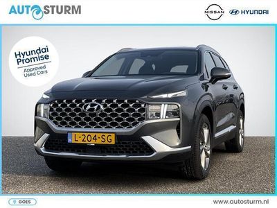 tweedehands Hyundai Santa Fe 1.6 T-GDI HEV Comfort Smart 7p. | Trekhaak | Navigatie | Camera | Stoelvewarming | Apple Carplay/Android Auto | Dodehoek | Adapt. Cruise Control | Premium Audio | Rijklaarprijs!