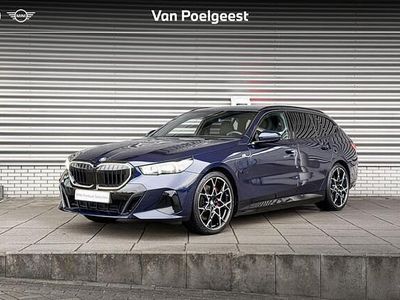 Bmw individual tansanit metallic (blauw metallic) Occasion 2025 BMW 550e Comfort Edition Stationwagen | € 79.900