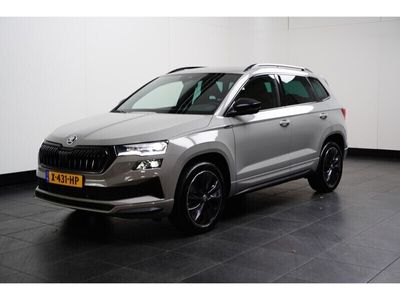 tweedehands Skoda Karoq 1.5 TSI 150PK DSG-7 Sportline Business | NAVIGATIE | CAMERA | STUUR + STOELVERW,