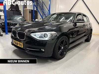 Zwart (metallic) Occasion 2014 BMW 114 Sport Line Hatchback | € 9.745 (Eerlijke prijs)
