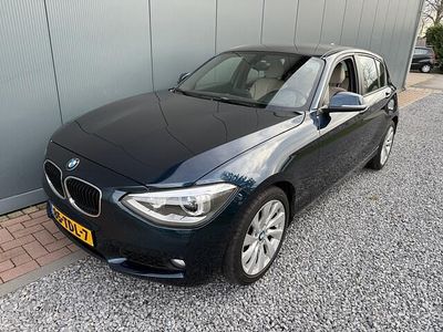 Blauw (metallic) Occasion 2012 BMW 116 Sport Line Hatchback | € 10.750 (Iets duurder)