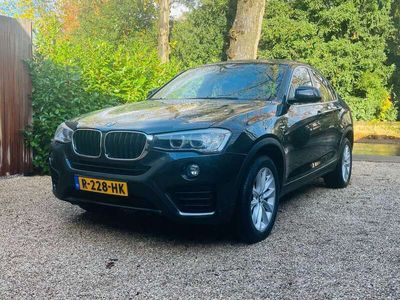 tweedehands BMW X4 xDrive20i schuif-kanteldak en dealer onderhouden