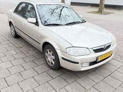 Occasion Mazda 323 88 PK (64 kW) 1999 Beige Sedan
