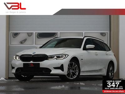 Wit Occasion 2021 BMW 320e Executive Stationwagen | € 25.940 (Eerlijke prijs)