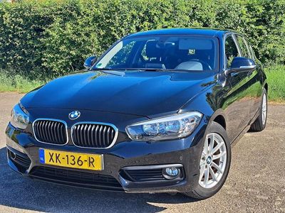 Zwart (metallic) Occasion 2015 BMW 116 Sport Line Hatchback | € 10.999