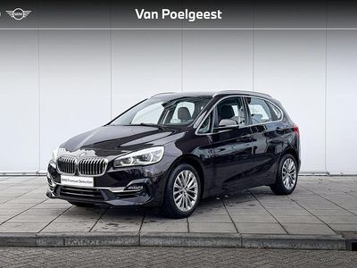 Sparkling brown metallic (donker metallic) Gebruikt 2021 BMW 218 Executive Stationwagen | € 25.900 (Eerlijke prijs)