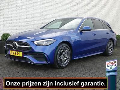Blauw (metallic) Gebruikt 2022 Mercedes C300 AMG line Stationwagen | € 34.900 (Goede deal)