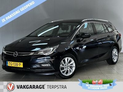 tweedehands Opel Astra Sports Tourer 1.4 Business Executive /150PK! /Apple + Android /KEYLESS! /Trekhaak /DAB+! /Navi /Climat /Cruise /Elek. pakket /Bluetooth /Regensensor /16"LMV /PDC V+A /LED Dagrijverl. /Chroom.