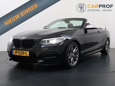 Zwart (metallic) Gebruikt 2016 BMW M235 Executive Cabriolet | € 27.995 (Eerlijke prijs)