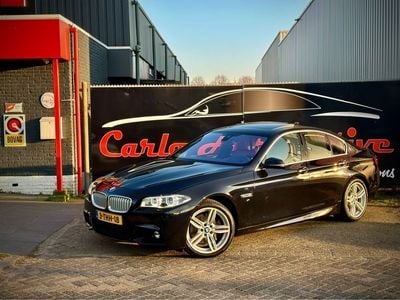 Zwart / azuritschwarz metallic Occasion 2014 BMW ActiveHybrid 5 M Sport Sedan | € 23.950