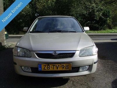 Occasion Mazda 323F 88 PK (64 kW) 1999 Beige, metallic lak Hatchback