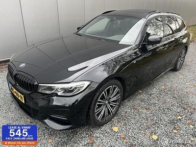 Zwart Occasion 2021 BMW 320 Executive Stationwagen | € 31.995 (Eerlijke prijs)