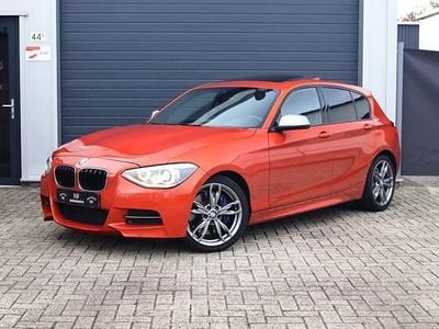 Oranje Occasion 2013 BMW M135 Advantage Hatchback | € 20.950