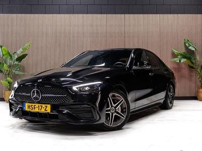 Zwart (metallic) Gebruikt 2024 Mercedes C300e AMG line Sedan | € 55.950 (Eerlijke prijs)