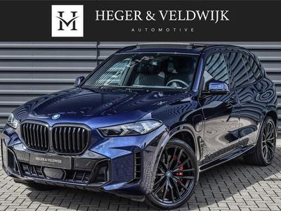 tweedehands BMW X5 xDrive50e M-SPORT PRO | PANORAMADAK | COMFORT SEATS MET MASSAGE FUNCTIE | ELEKTR. TREKHAAK | COMFORT ACCES | HARMAN KARDON | 360 CAMERA | AMBIANCE SFEERVERLICHTING | HEAD UP DISPLAY | ICONIC GLOW GRILLE