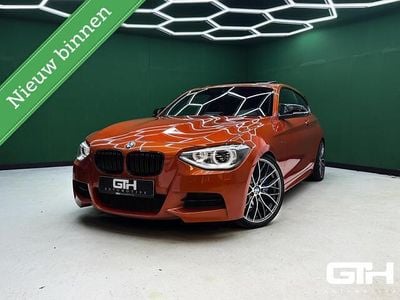 Oranje Occasion 2013 BMW M135 Comfort Edition Hatchback | € 16.950 (Goede deal)
