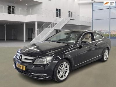 Zwart Occasion 2013 Mercedes C180 Prestige Coupé | € 12.999 (Goede deal)